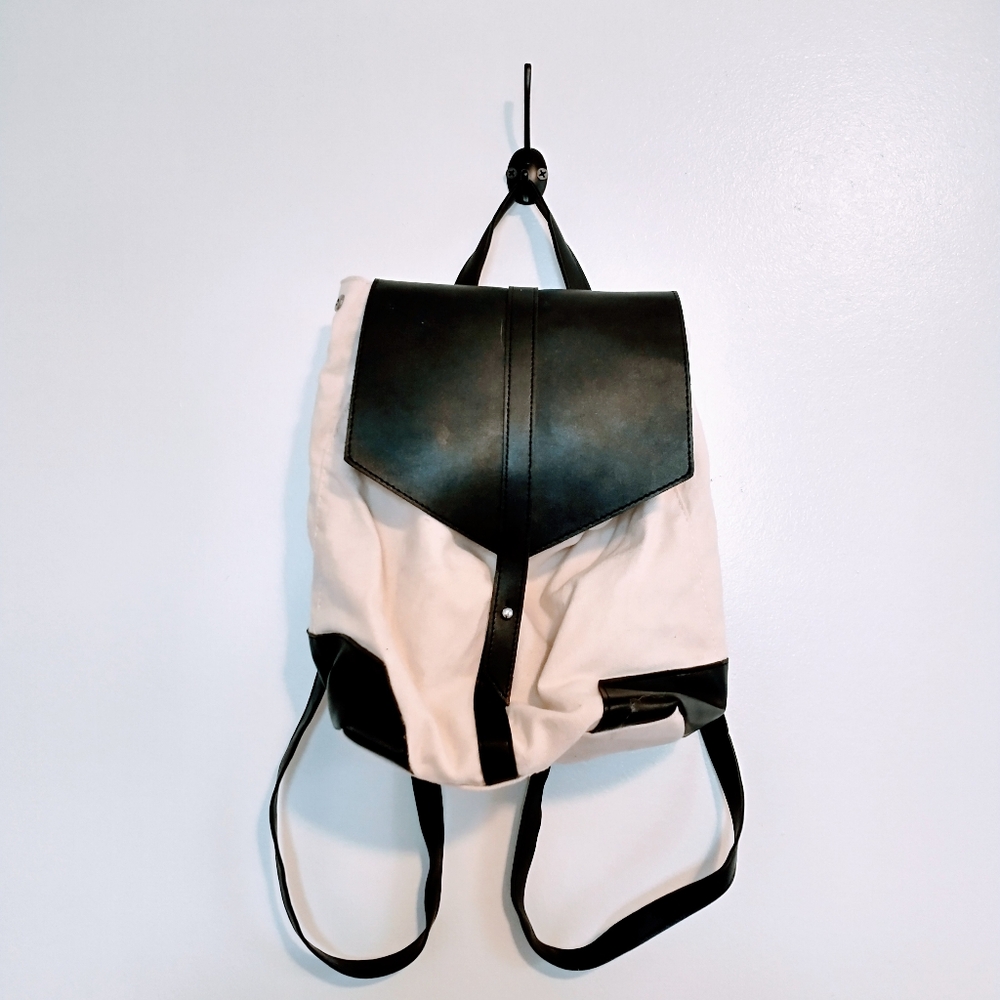 Deux Lux beige and black faux leather mini bag with buttons on the side to expan